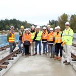 Mayor Ferrell and Sound Transit staff stand under Structure C which includes the longest bridge built by Sound Transit. The bridge was completed recently and they are now moving to the next phase that focuses on the rail itself atop the bridge. Photo by Keelin Everly-Lang / the Mirror