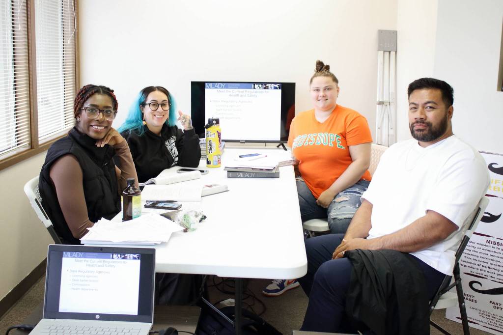 Students Keyaura KM-WR, Betzy Martinez, Sam Folk and Daren Lefeau are in their third week class at the Lifes Styles barber school in Federal Way. Photo by Keelin Everly-Lang / the Mirror.