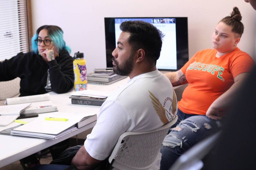 Betzy Martinez, Daren Lefeau and Sam Folk are three weeks into their barbering program through Lifes Styles that will prepare them for the barber exam to become licensed to work. Photo by Keelin Everly-Lang / the Mirror.