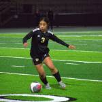 Decatur sophomore Kaihea Tuifua dribbles the ball between White River defenders. Ben Ray / The Mirror