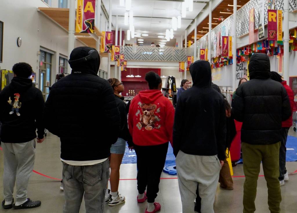 Students from Thomas Jefferson High School listening to instructions about the trash sorting activity. Photo by Joshua Solorzano/The Mirror