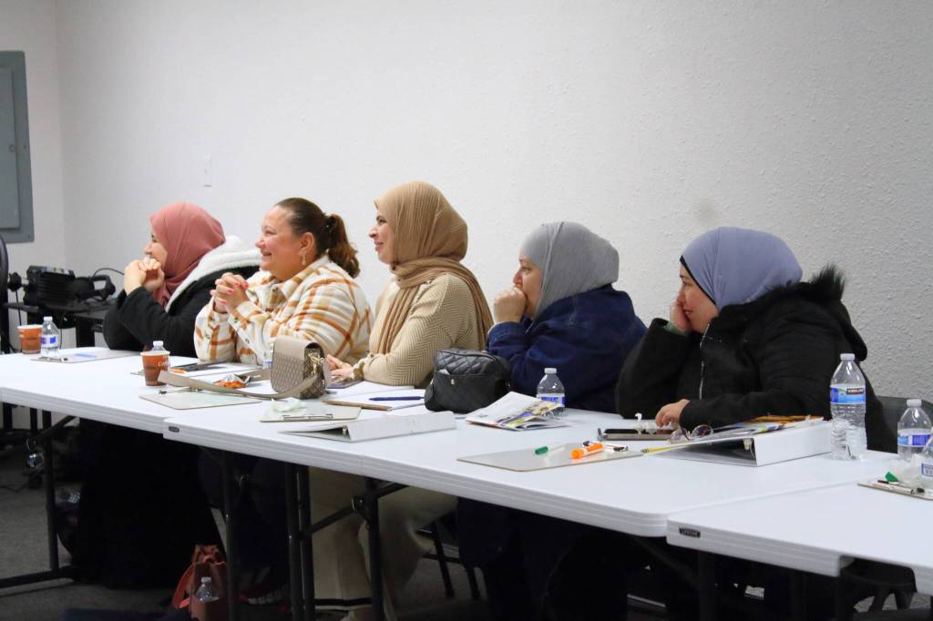 Participants in the Arabic/Kurdish language driving class at Mujer al Volante at their graduation on Nov. 11.