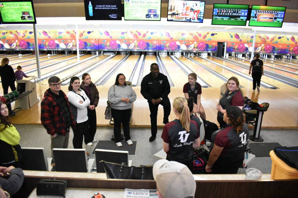 Head Coach Joe Townsend talks with his team after a historic victory.