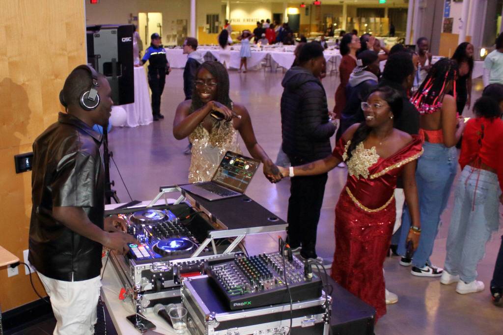 A DJ at the 2023 AYDEPI Winter Ball keeps the music going for attendees at the free event.