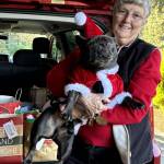 Maxine Ranta and her dog Jaxson accompanied the Marine Hills Garden Club members to deliver gifts and floral arrangements this holiday season. Photo provided by Debbie Angel