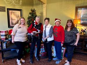 Rachel OReilly from Life Care Center, Maxine Ranta, Diane Goss, Penny Merriman and Carrie Asselin working together to brighten the holidays for everyone. Photo provided by Debbie Angel.