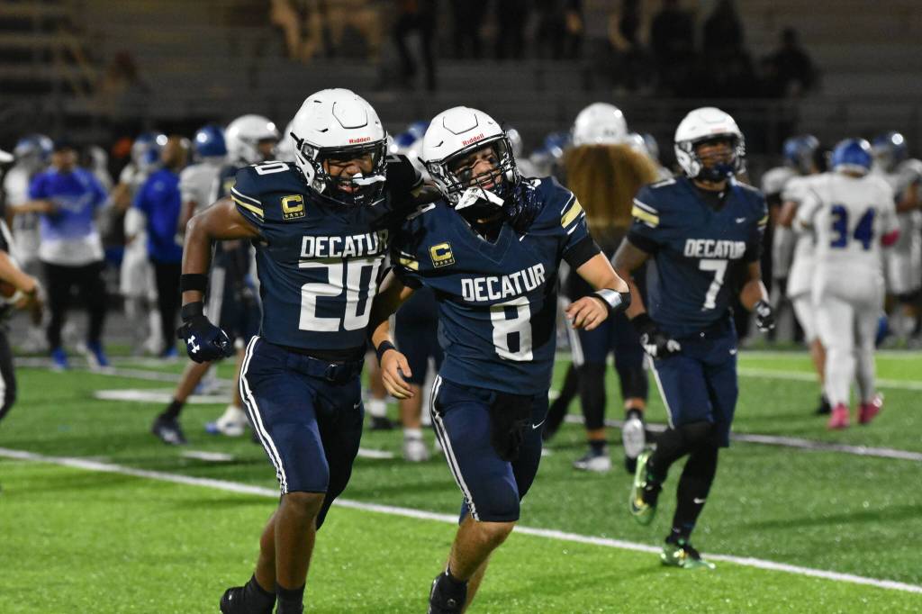 Decatur High Schools Maddox Heyliger (20) and Spencer Holloway (8) celebrate by running over to fans together after defeating Federal Way High School in September. The Decatur Gators football team made it to the state tournament for the first time in school history, but their historic season was cut short 23-21 in a loss to the Mount Tahoma Thunderbirds on Nov. 15. File photo