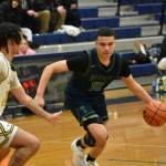 Titan senior Jaylin Wells dribbles against Kentridge. Ben Ray / The Mirror
