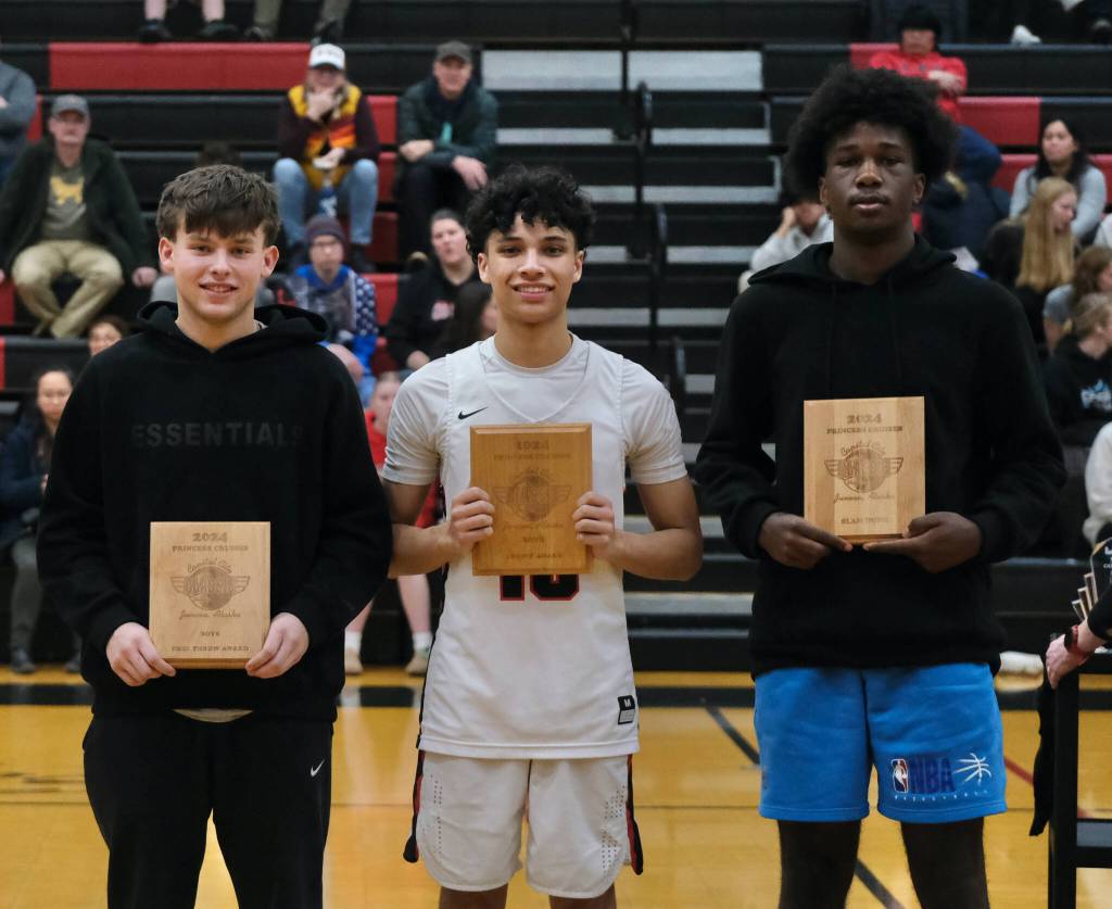 The 2024 GHCCC boys free throw champion Easton Hawkins (Soldotna), three-point champion Pedrin Saceda-Hurt (Juneau-Douglas High School: Yadaa.at Kalé) and dunk champion Damari Adams (Soldotna). (Klas Stolpe / Juneau Empire)