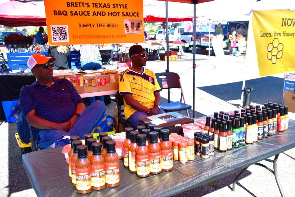 Barbecue and hot sauce were one of the many delicious items for sale at the Federal Way Farmers Market on Saturday, June 29. Photo by Bruce Honda.