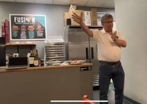 David Harrelson, secretary for the Federal Way Public Market committee, explains the vision behind the project during the Federal Way Mirrors monthly Hot off the Presses event Jan. 14 at Poverty Bay Cafe. He was joined by AnnMichelle Hart, Chief of Staff for the Federal Way Public Market. Mirror staff photo