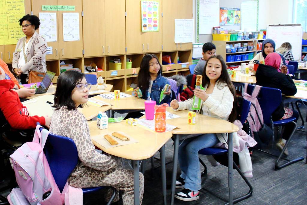Students enjoy breakfast in the classroom as they start their day at Lake Grove Elementary School on Jan. 17. Photo by Keelin Everly-Lang / the Mirror.