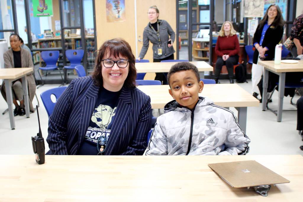 Principal Amanda Wilde of Lake Grove Elementary with a student ambassador. Photo by Keelin Everly-Lang / the Mirror.