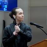Koleton Hart, Jesse Sareys younger brother, showing the judge a photo of him, Jesse and family. Photo by Joshua Solorzano/Sound Publishing