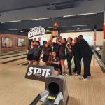 Raiders hoist the golden bowling ball after winning the state tournament. Ben Ray / The Mirror