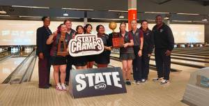 Raiders pose with the trophy after winning the state tournament. Ben Ray / The Mirror