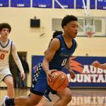 Marcel Jones drives to the basket against Auburn Mountainview. Ben Ray / The Mirror