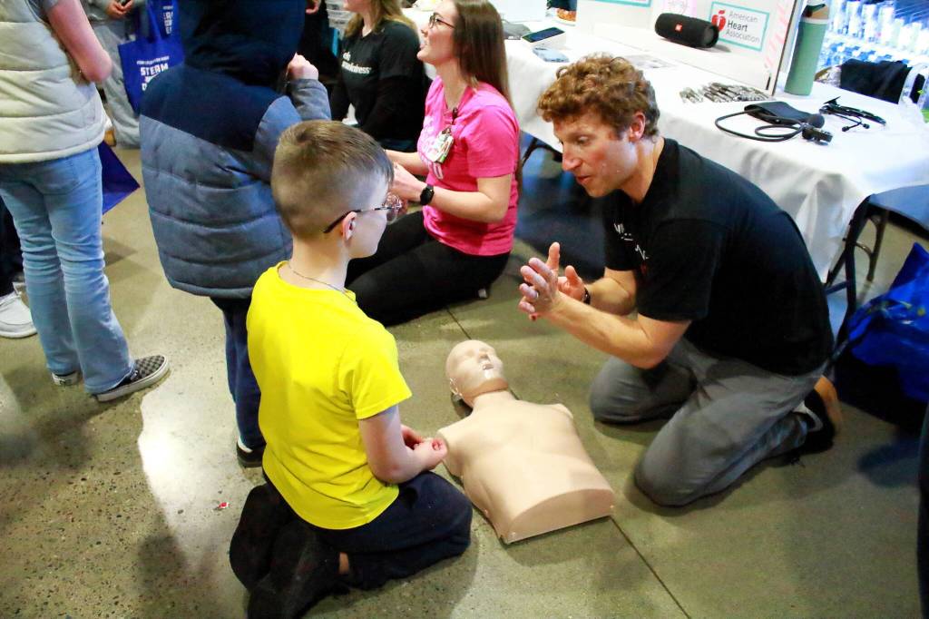 Students and instructors from the Allied Academy Healthcare Services program through Virginia Mason Franciscan Health showed students how to do CPR. Photo by Keelin Everly-Lang / the Mirror