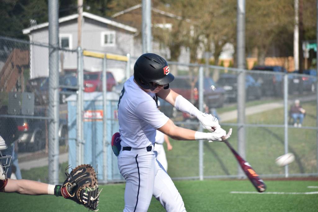 Decatur shortstop Spencer Holloway doubles against White River. Ben Ray / The Mirror