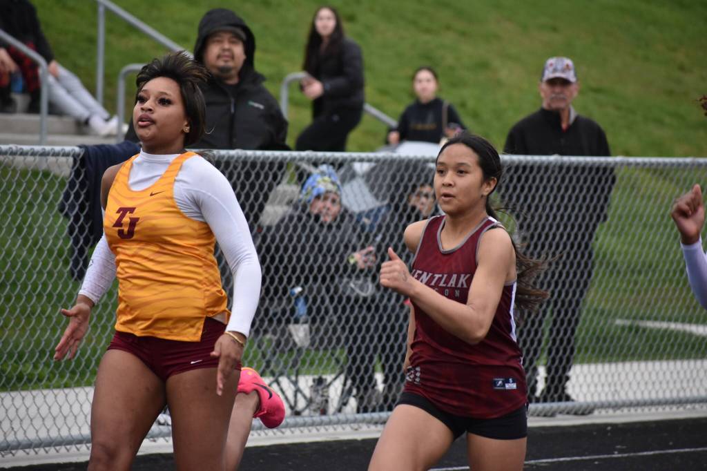 Thomas Jefferson and Kentlake go step for step in the 100 meter dash. Ben Ray / The Mirror.