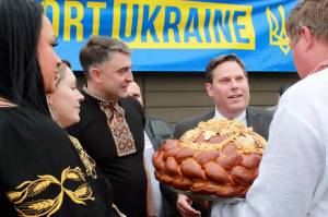 Mayor Jim Ferrell received an award of appreciation and an elaborate loaf of bread from the Ukrainian community of Federal Way at their event on March 30. Photo by Keelin Everly-Lang / the Mirror