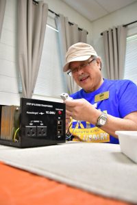 Gary works on a transformer at the South King Tool Librarys Repair Cafe event on March 29, 2025. The event is a free opportunity for the community to repair all kinds of items instead of throwing them away. Photo by Bruce Honda