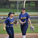 Luci Pech and Valentina Cruz-Castro smile after catching a pop fly. Ben Ray / The Mirror