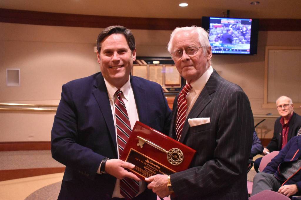 Federal Way Mayor Jim Ferrell, left, presents Bob Roegner with a Key to the City on Jan. 4, 2023. File photo