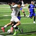 Maryoni Bonilla Ruiz leaps over a Kent-Meridian defender. Ben Ray / The Mirror