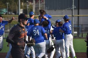 Titus Gillihan is showered with water after hitting the game-winning hit. Ben Ray / The Mirror