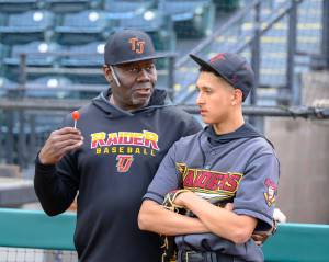 Joe Townsend and a young Raider pitcher discuss tactics at Cheney Stadium. Photo by Dee Torres