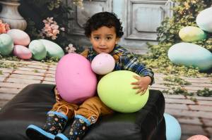 This years Easter Egg hunt at the Light of Christ Community Garden featured fun photoshoots with giant easter eggs. Photo by Shelley Pauls