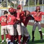 Raiders celebrate a walk off win over Auburn Mountainview. Ben Ray / The Mirror