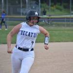 Sam Hackney smiles at her coach as she rounds third base after hitting a home run. Ben Ray / The Mirror