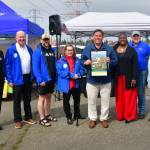Local leaders celebrate the 2025 opening day of the Federal Way Farmers Market - and the first market under the new management by the City of Federal Way. Photo by Bruce Honda