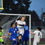 Dylan Lang makes a clearing header on a corner kick for Decatur. Ben Ray / The Mirror