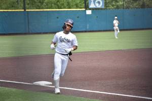 CJ Gatterson rounds the bases after hitting a home run against Enumclaw. Ben Ray / The Mirror