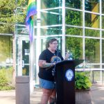 Allison Fine speaks at the Pride flag raising at City Hall, sharing the history of how the flag came to be flown in the city - which was in part due to her advocacy - and about the challenges still faced by the LGBTQ community. Photo by Keelin Everly-Lang / the Mirror