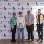 Austin May stands with Dr. Dani Pfeiffer (left), Federal Way Director of Equity and Athletics John Yellam (center right) and Federal Way Mirror Sports Reporter Ben Ray (far right). Photo provided by FWPS.