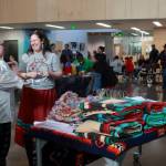 Amanda Rambayon laughs with a ProStart intern who helped prepare dinner at the Native Graduation event on May 29. Photo by Keelin Everly-Lang / the Mirror.