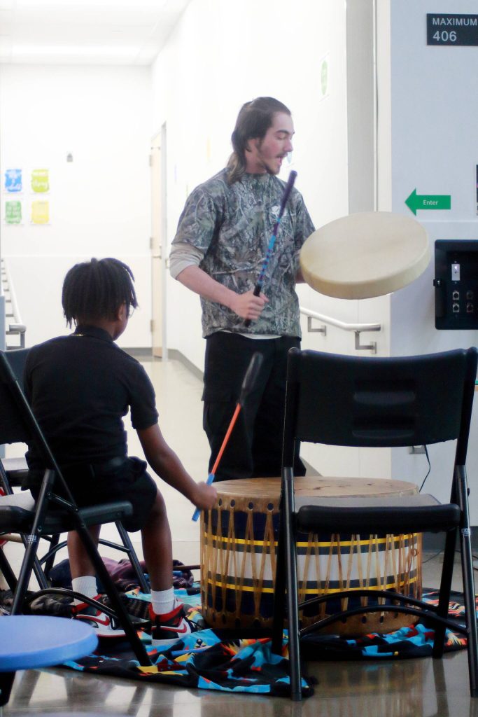 Xaiver Byers is a graduate of Truman several years ago and now came full circle to drum and share songs at the Native Graduation for Federal Way Public Schools. Photo by Keelin Everly-Lang / the Mirror.