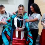 Graduating seniors were wrapped in a blanket as part of the celebration at the Native Graduation for FWPS. Photo by Keelin Everly-Lang / the Mirror