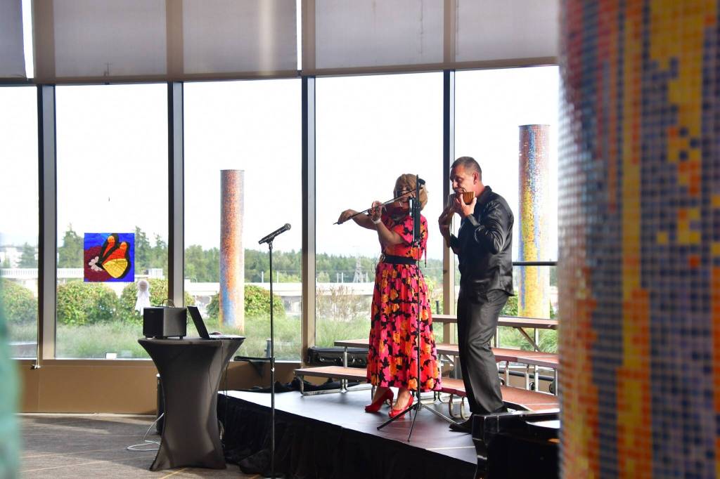 Galina and Andrey Galeewa / Pan Flute and Violin. Photo by Bruce Honda
