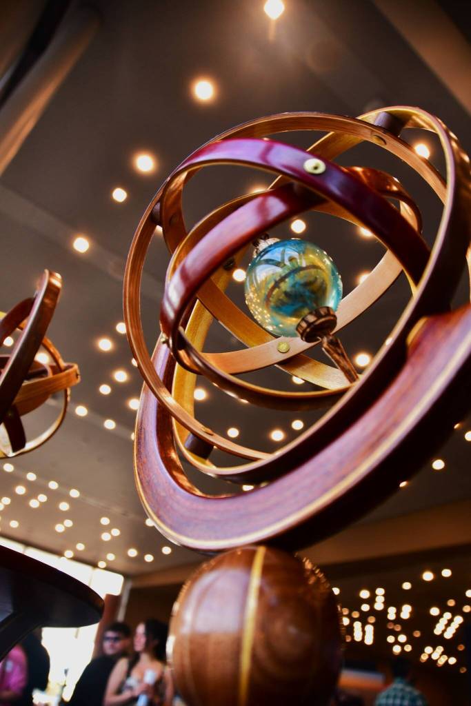 The Arts Explosion included a wide variety of art styles and mediums, including this sculpture entry made of wood and glass.