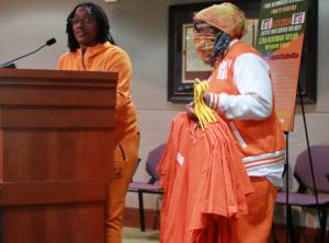 Selena Taylor speaks at the Federal Way City Council meeting on June 3 along with her mother Betty Taylor. They brought several posters up to the podium with them, honoring the memory of their son and grandson, respectively, Ezra Taylor, who died of gun violence in 2021. Photo by Keelin Everly-Lang/The Mirror