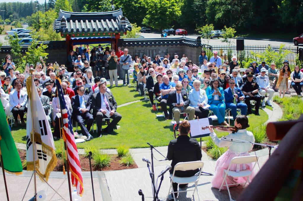 The audience was seated on the Taegeuk patterned lawn as they enjoyed a performance by Elina Berkovich on the haegeum and Marie Park on the violin. This view is from the pavilion itself. Photo by Keelin Everly-Lang / the Mirror