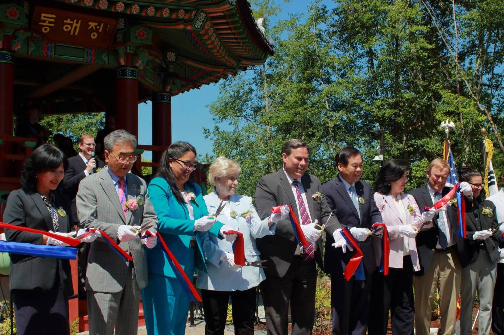Local leaders cut the ribbon at Hanwoori Garden including: Deputy Consul General for the Republic of Korea Mijo Park, President of the Federal Way Korean American Association Daniel Kim, Representative Kristine Reeves (D-30th District), Federal Way City Council President Linda Kochmar, Federal Way Mayor Jim Ferrell, Former Federal Way Mayor Mike Park, Consul General for the Republic of Korea in Seattle Eunji Seo, King County Councilmember Pete von Reichbauer and Superintendent of Federal Way Public Schools Dr. Dani Pfeiffer. Photo by Keelin Everly-Lang / the Mirror