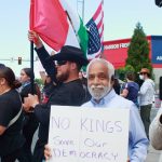Community members showed their support in many ways, some through signs and others who spread a message of celebrating multifaceted identities like these demonstrators who joined a Mexican and American flag. Photo by Keelin Everly-Lang/the Mirror
