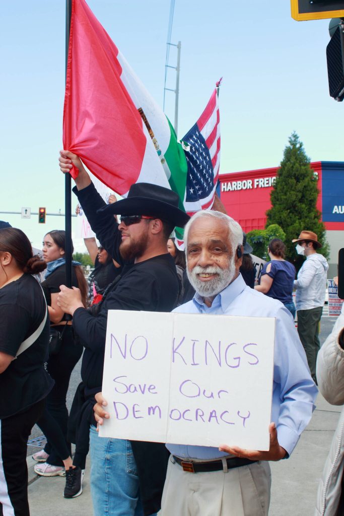 Community members showed their support in many ways, some through signs and others who spread a message of celebrating multifaceted identities like these demonstrators who joined a Mexican and American flag. Photo by Keelin Everly-Lang/the Mirror