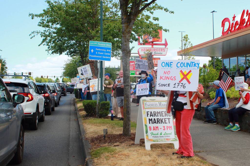 The No Kings demonstration extended out from the intersection of Pacific Highway South and South 320th Street on Saturday, June 14, past Dicks Burgers and to the Harborstone Credit Union. Photo by Keelin Everly-Lang / the Mirror
